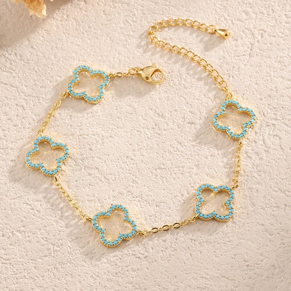 Yupsk Blue Zircon Four-Leaf Flower Bracelet – Hollow Exquisite Jewelry Gift for Women