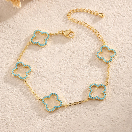 Yupsk Blue Zircon Four-Leaf Flower Bracelet – Hollow Exquisite Jewelry Gift for Women