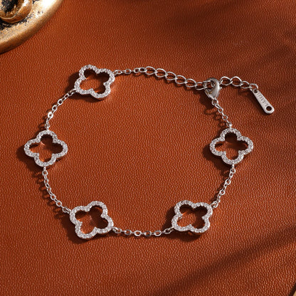 Yupsk Blue Zircon Four-Leaf Flower Bracelet – Hollow Exquisite Jewelry Gift for Women