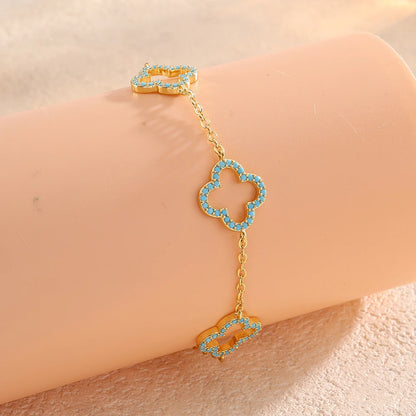 Yupsk Blue Zircon Four-Leaf Flower Bracelet – Hollow Exquisite Jewelry Gift for Women