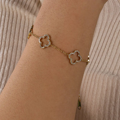 Yupsk Blue Zircon Four-Leaf Flower Bracelet – Hollow Exquisite Jewelry Gift for Women
